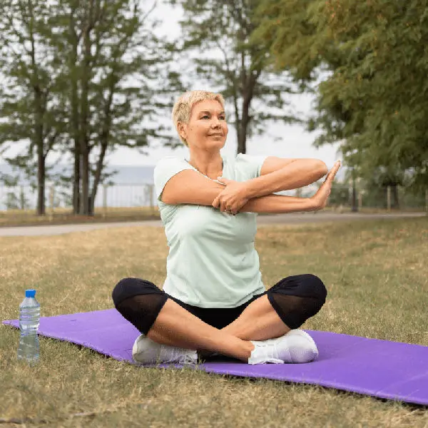 Woman stretching on a yoga mat