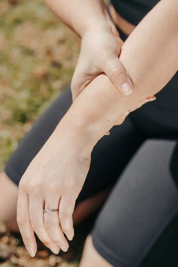 Person rubbing wrist