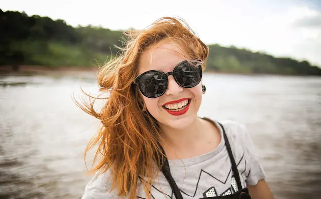 Woman in front of a lake